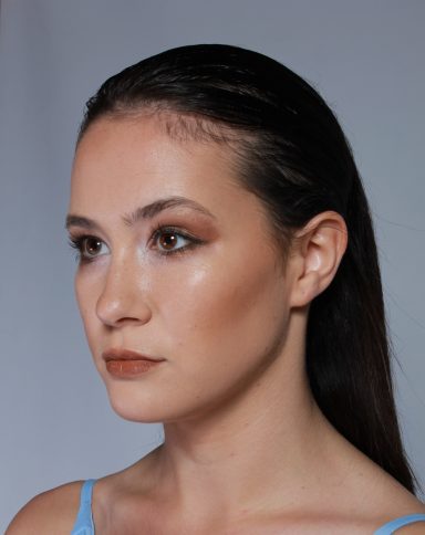 Editorial beauty makeup featuring glowing skin and soft glamour.