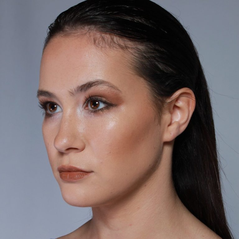 Side profile of a striking model with soft nude, editorial makeup, at a Chester studio, featured in Intima magazine. 
