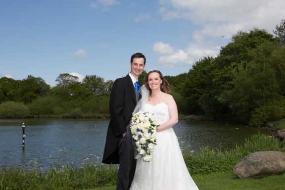 Long distance shot of bride and groom, following bridal makeup application, with luxury lashes