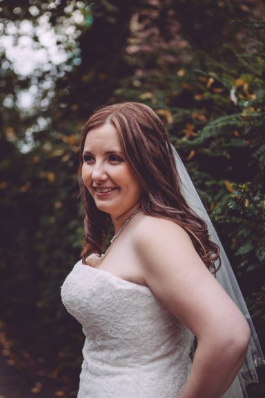 Bride smiling at the camera at the Chester Grosvenor after her radiant bridal makeup. 