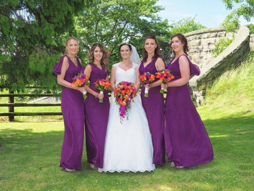 Manchester bride with her bridal party at their Cheshire ceremony, all with soft, radiant makeup.