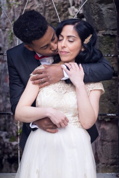 Happy couple embracing at Rhuthin Castle, Flintshire